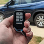 Car key replacement service in the USA with locksmith programming a modern smart key